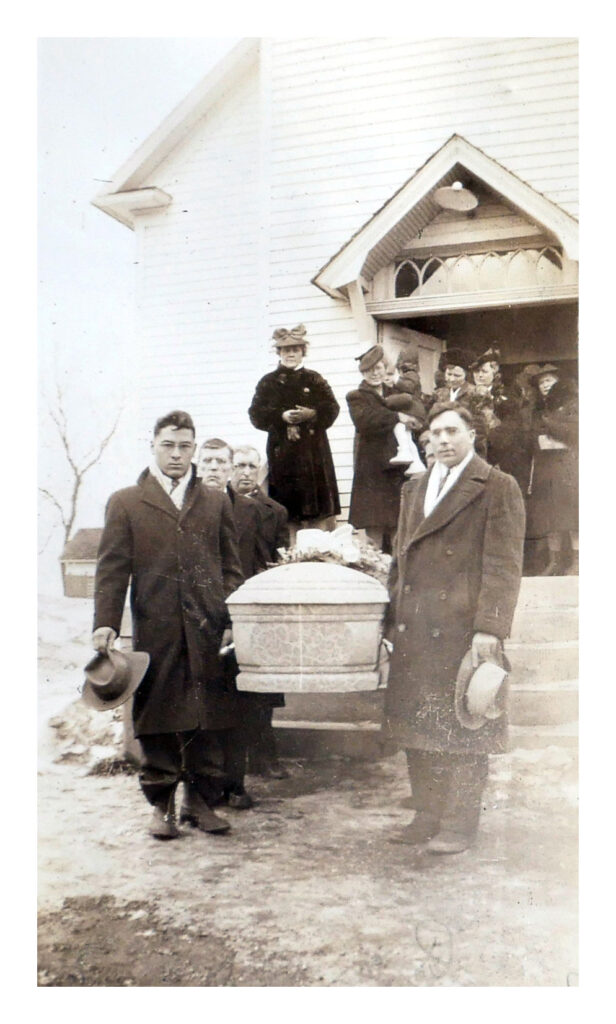 Family members carry the casket of Anna Dahl